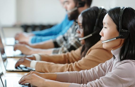 Answering service workers at a table