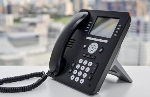 Office phone sitting on table