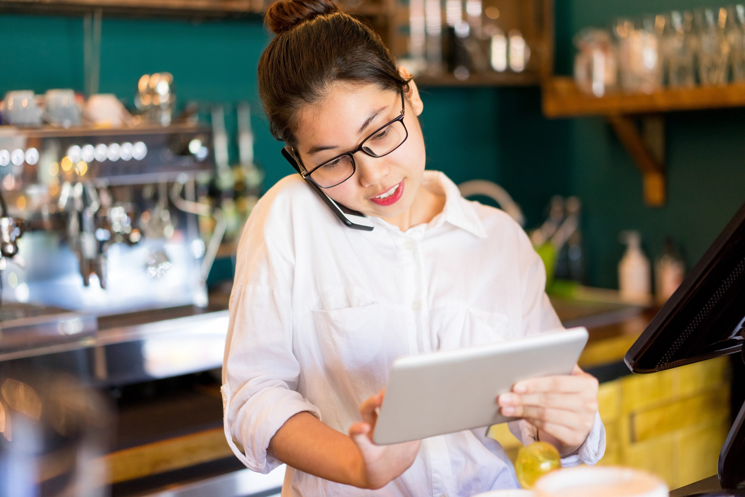 Confident restaurant manager answering phone